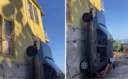 Antalya’da bir vatandaş, kazaya karışan aracını iple binadan aşağıya sarkıttı